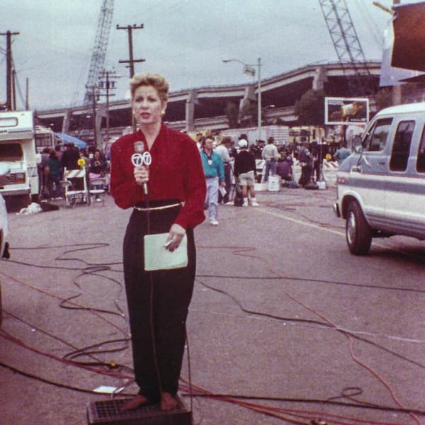 Sarah Wallace reporting from a construction site with a Channel 7 microphone.