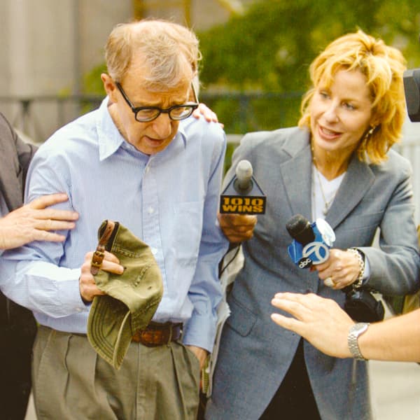 Sarah Wallace in a media scrum covering Woody Allen.